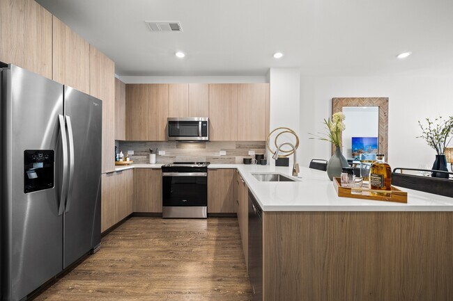 Chef-inspired kitchen with premium appliances - Hanover Evans Station