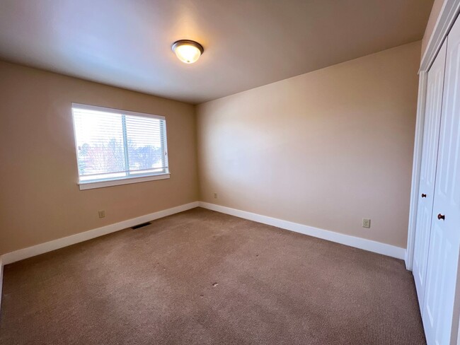 Photo - 3-Bedroom Townhome with Double Garage & Private Fenced Yard