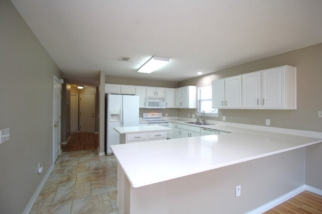 Photo - 2BR/2BA Southwest Pensacola Patio Home with Fenced Yard, Open Deck, and Modern Kitchen – Minutes ...