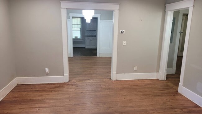 Entry living room opens into dining and bedroom hallway - 309 Dargan Pl SW Unit NA