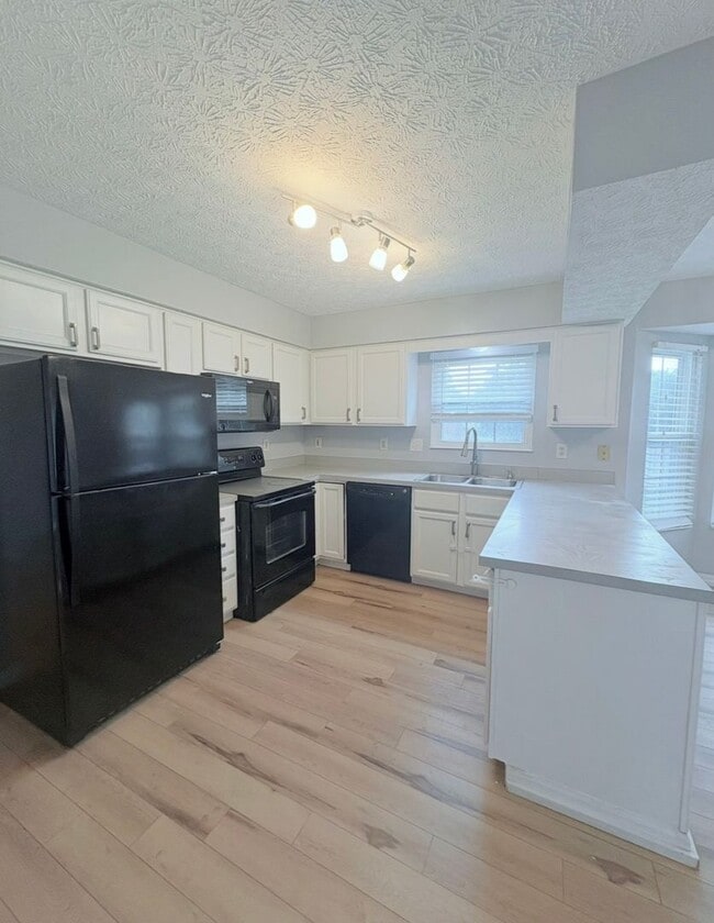 Photo - 4BR/2.5BA | Newly Flooring | Garage | Gated back yard