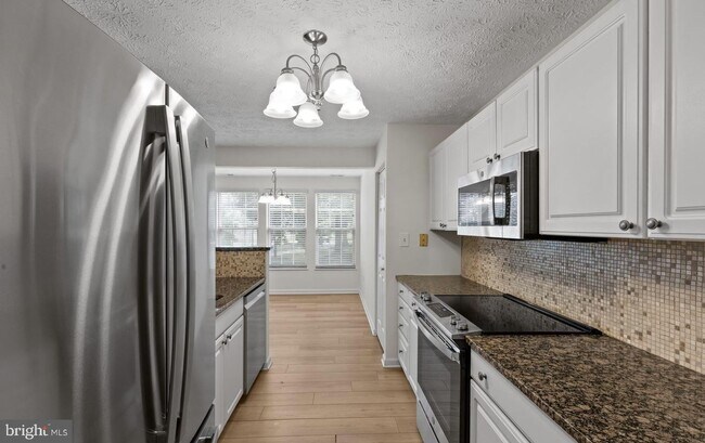 Photo - Welcome to Piney Orchard! This beautifully updated 2-bedroom, 2-bath condominium!
