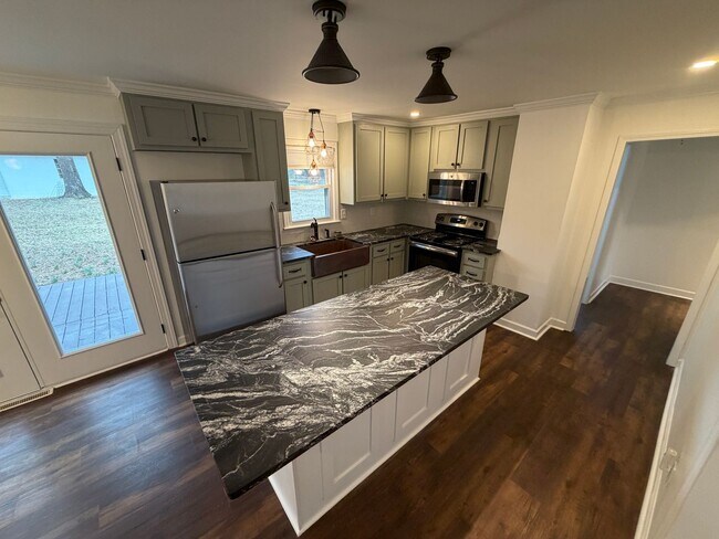 Photo - 2 Bedroom 2 Bath Brick rental home in Western Alamance county Fenced Yard 30x40 Garage custom Kit...