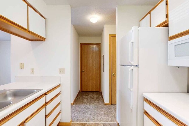 The Bonsai studio floor plan makes the most of every inch, with a galley-style kitchen that keeps essentials organized and easy to access. - Highland View Apartments