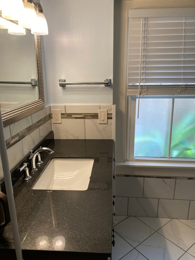 Completely tiled large bath w/ great storage - 1561 Webster St