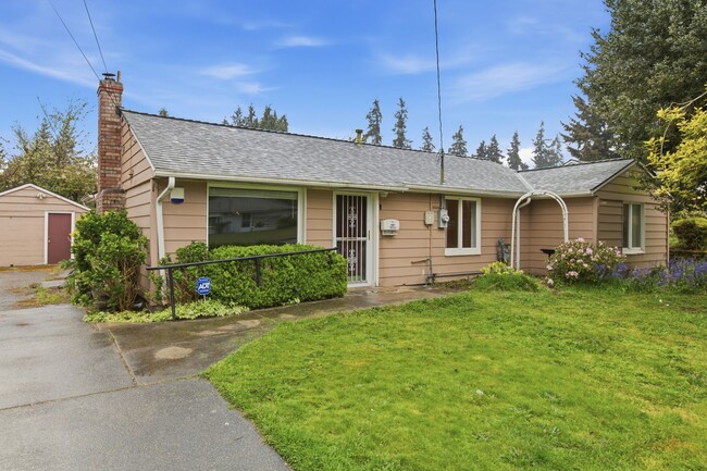 Photo - Cozy 4-Bedroom Home with Wood Stove & Large Backyard in Mountlake Terrace