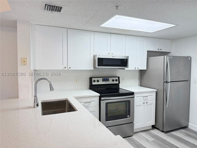 5045 Wiles Rd Unit 303