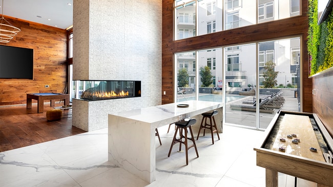 Clubroom with firepit, billiards table, and shuffle board