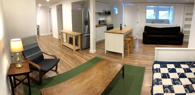 View of kitchen with hallway to bedroom/bathroom on left - 2415 E 12th St Townhome