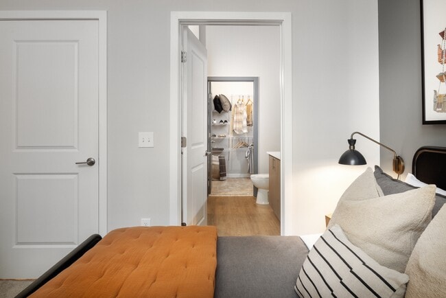 Primary bedroom with bath and walk-in closet