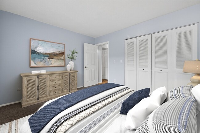 Explore the serene interiors of Park Village West. This well-appointed bedroom features soft hues, ample storage, and a tranquil atmosphere that invites relaxation. Elevate your living experience—come see for yourself today!