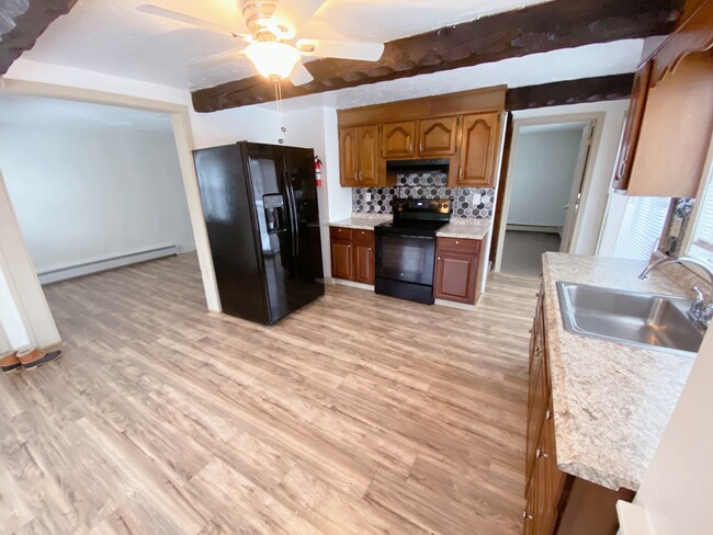 Kitchen toward Living Room - 423 Main St Unit Apartment