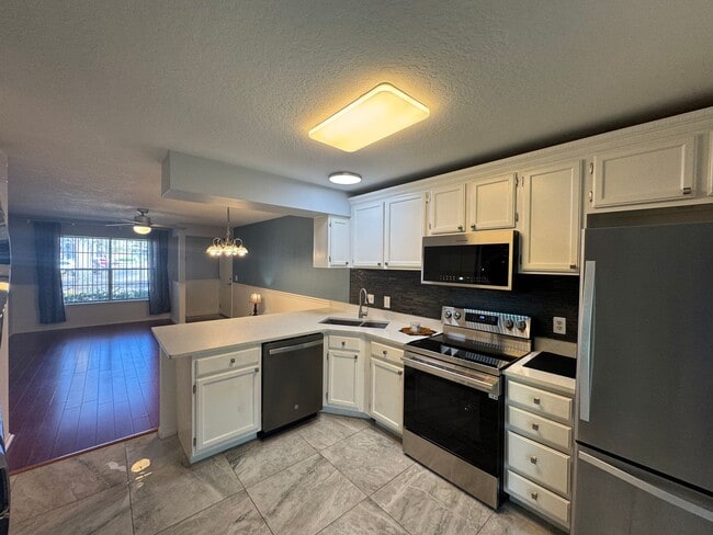Photo - Charming 2-Bedroom Condo with Pool Access & Water Included – Prime Orlando Location