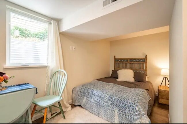 There is now a smart TV mounted to the wall on a swivel so you can enjoy from bed or the kitchenette - 3330 SE Franklin St