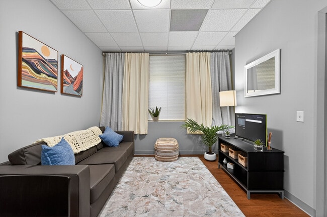 Bright Living Room with Natural Light at University Plaza NIU Off-Campus Apartments