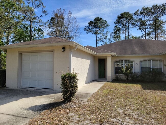 Building Photo - $1495 - 3/2/1 - Duplex Palm Coast - Move In Special