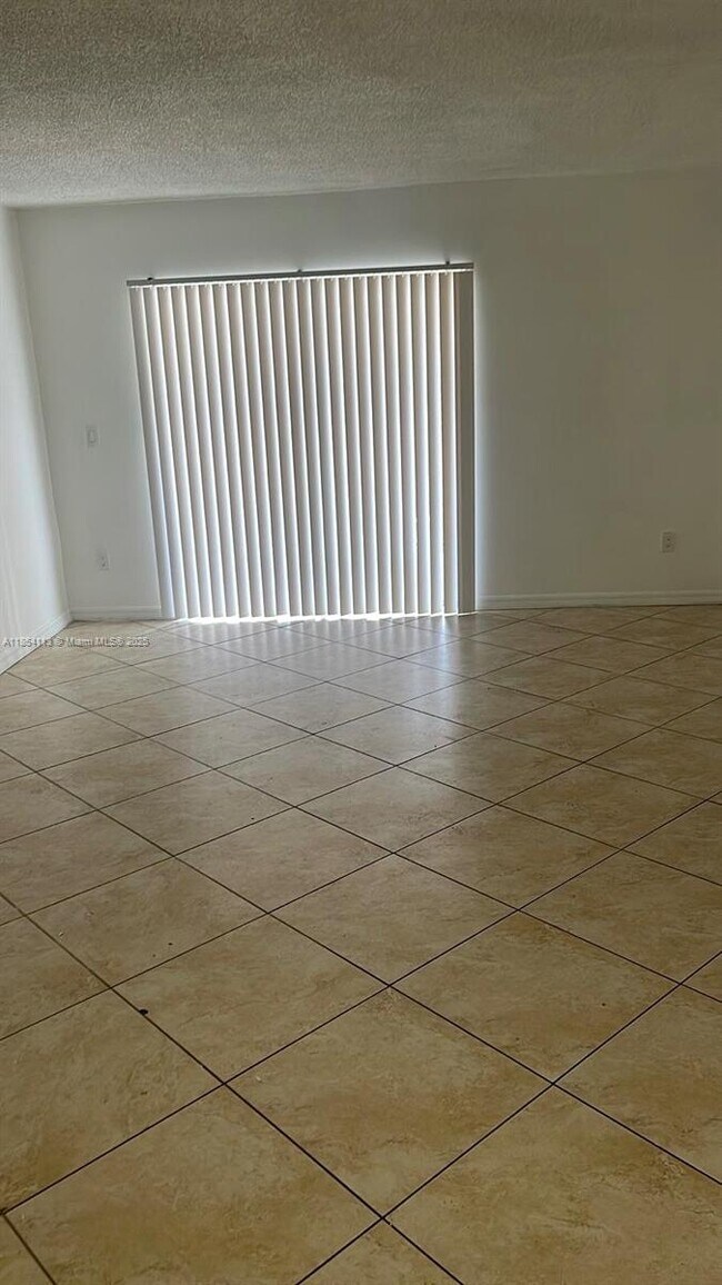 Building Photo - 18880 NW 57th Ave Unit 203 Rental