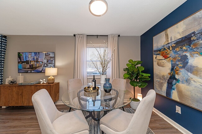 Dining area with hardwood-style flooring