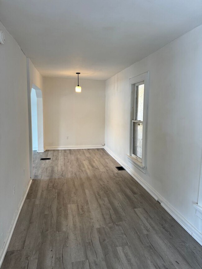 Photo - 2 bedroom 1 bath single family home. Freshly painted with new flooring .