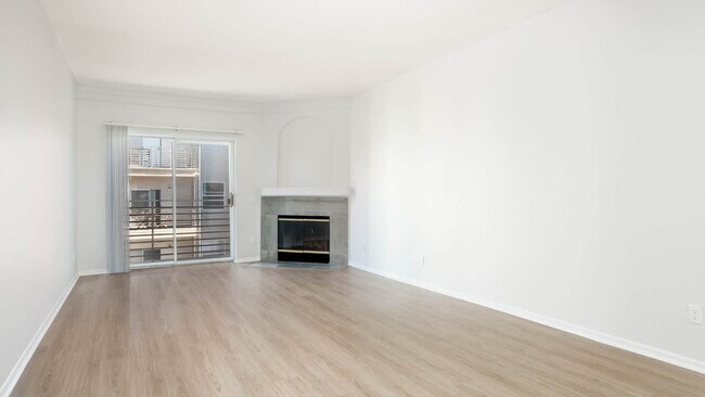 Living Room with Fireplace and Balcony