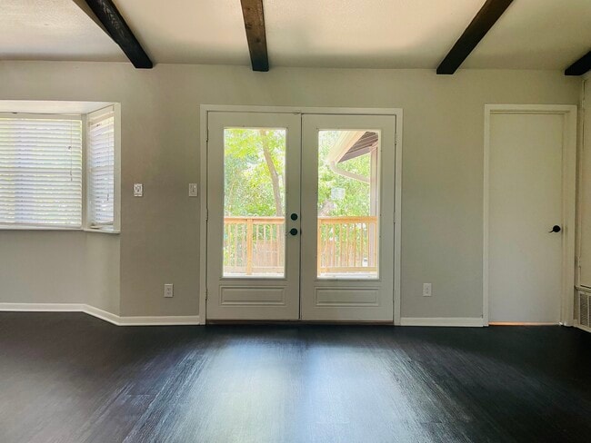 exposed beams, french doors to backyard - 6717 Tulsa Cove