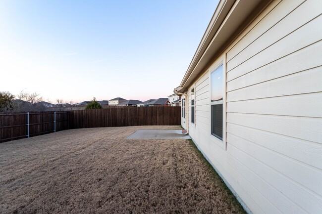 Photo - Located in the Trails at Riverstone community, this inviting 5-bedroom, 2-bathroom home offers a ...