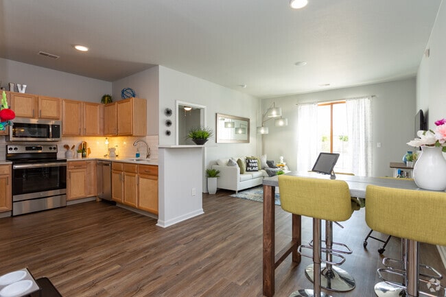 Spacious apartment homes with hardwood inspired vinyl flooring and open Kitchen/Dining spaces.