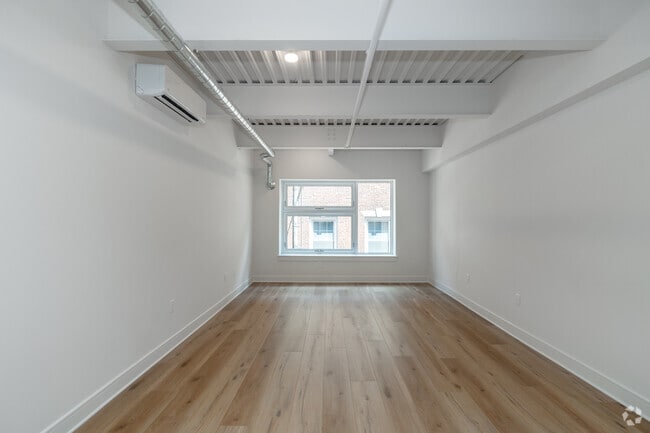 Studio - 555SF - Living Room - The Apartments at 101 North Queen