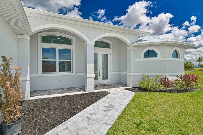 Photo - NOW AVAILABLE - Gorgeous Pool Home ~ NW Cape ~ 3 Car Garage ~ On Canal!