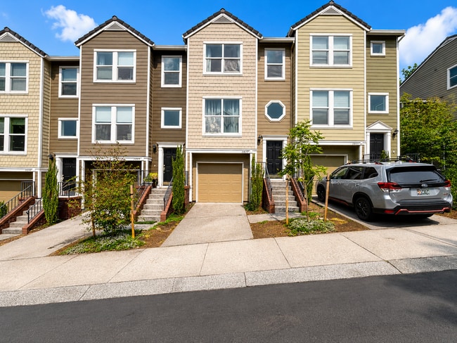 Building Photo - Spacious 3-Bedroom Forest Heights Townhome with Dual Primary Suites, Ground-Level Bedroom, Privat...