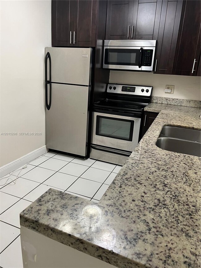 Building Photo - 8307 SW 142nd Ave Unit F103