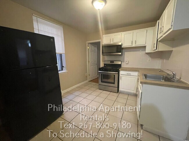 Kitchen (has newer fridge) - 2148 N Carlisle St Apartments