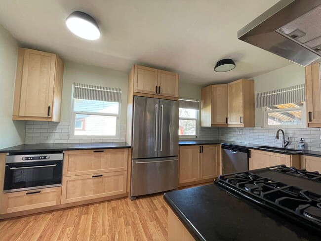 Photo - St. Johns 1940s 2Bd 1Ba home with updated Kitchen and a Basement! Features a Stained glass Outdoo...