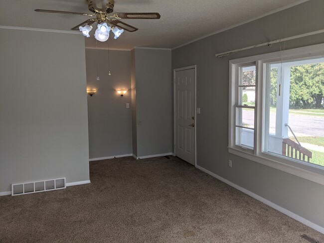 Living Room - 411 13th St N Apartments Unit A