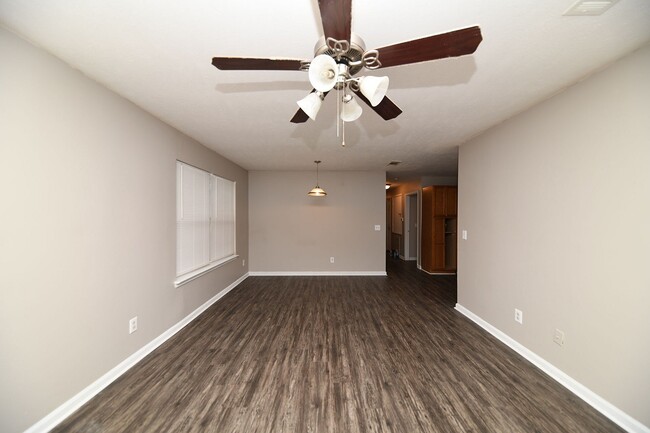 Spacious living room with hardwood-style flooring