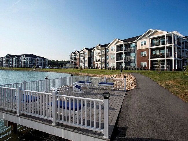 A deck overlooking the pond provides a serene place to relax or fish.