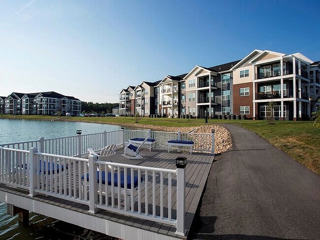 A deck overlooking the pond provides a serene place to relax or fish. - WaterStone at Green River