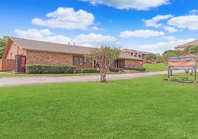 Beautifully landscaped grounds with open green lawns and shade trees. - Sierra Nevada Rental