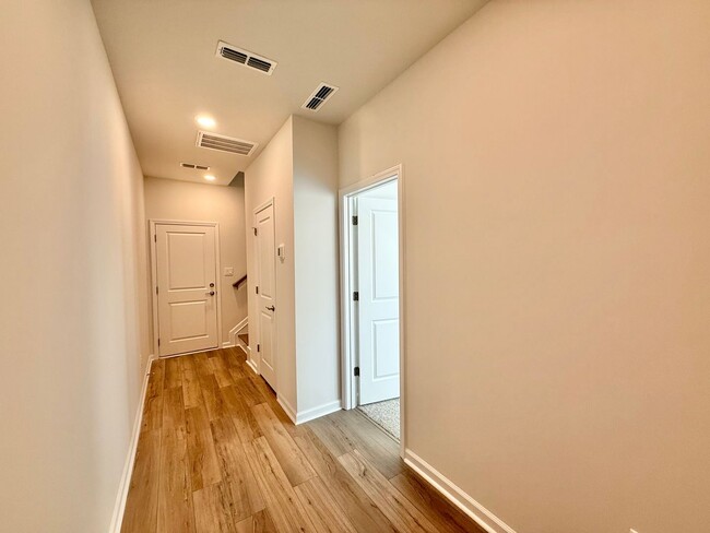 Photo - Stunning New Construction 4BD, 3.5BA Apex Townhome with a 2-Car Garage in a Prime Location Near T...