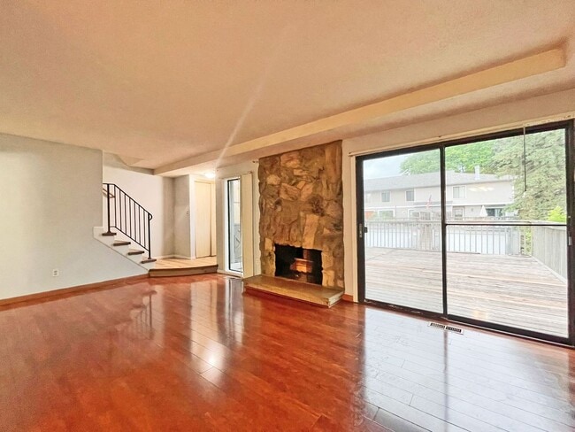 Photo - Spacious End-Unit Townhome with Fireplace, Family Room, 2-car Garage, Community Pool & Playground...