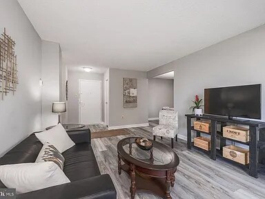 The living room 1 of 2. - 4500 S Four Mile Run Dr Condo Unit 206