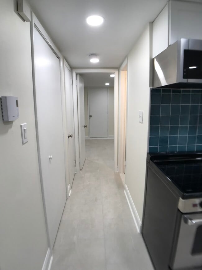 Hallway: walk-in closet and bathroom off this hallway - 152 13th St SE Unit #B