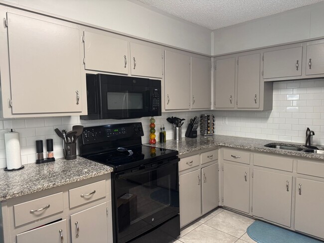 Photo - Spacious 4-Bedroom Home with Den, Fenced Yard & 3-Car Garage. Available Late July!