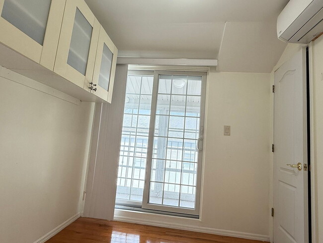 Photo - "Charming 2-Bedroom Retreat in Douglaston – Cozy Comfort with 710 Sq Ft of Living Space!"
