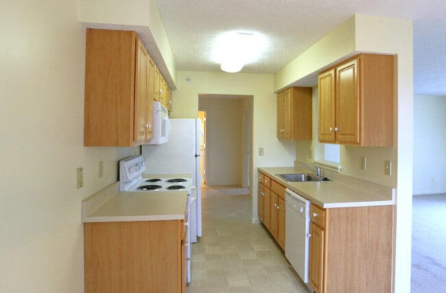 Un dormitorio - Cocina - New Country Village Apartments