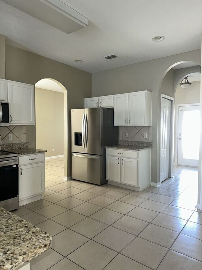 Photo - PALM COVE - 4/3 WITH ADDITIONAL DEN AND UPSTAIRS LOFT