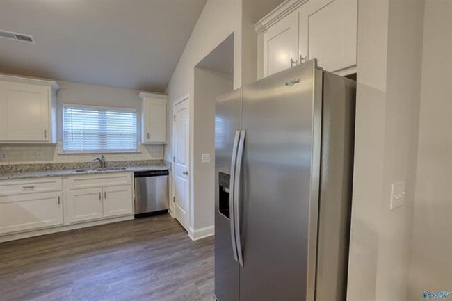 Photo - Fall in love with this stunning 4-bedroom, 3-bathroom full-brick ranch home