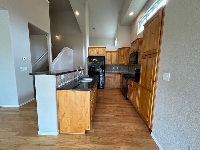 Photo - $500 Off First Month Of Rent! Modern 3BR Townhome with Fenced Yard & Garage