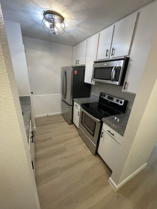 New Kitchen Appliances and Flooring - 7950 N Stadium Dr Unit 172