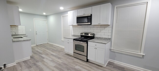 kitchen with stove - 274 Plantation St Apartments Unit 1